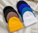 Solid-red-ribbed-knit-winter-beanie-hat-with-a-cuffed-brim-on-a-white-background-for-custom-logo-wholesale-6