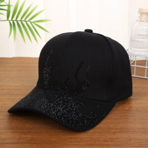 White-baseball-cap-featuring-a-shiny-crystal-rhinestone-flame-pattern-on-the-front-and-brim-placed-on-a-wooden-table-5