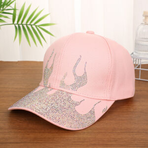 White-baseball-cap-featuring-a-shiny-crystal-rhinestone-flame-pattern-on-the-front-and-brim-placed-on-a-wooden-table-7