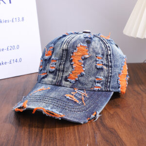 Wholesale-washed-black-denim-baseball-cap-with-custom-distressed-ripped-holes-revealing-a-bright-blue-underlayer-displayed-for-bulk-clothing-supplier-10