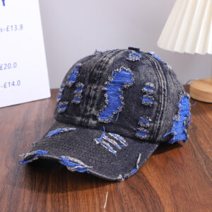 Wholesale-washed-black-denim-baseball-cap-with-custom-distressed-ripped-holes-revealing-a-bright-blue-underlayer-displayed-for-bulk-clothing-supplier-5