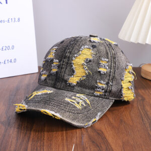 Wholesale-washed-black-denim-baseball-cap-with-custom-distressed-ripped-holes-revealing-a-bright-blue-underlayer-displayed-for-bulk-clothing-supplier-6