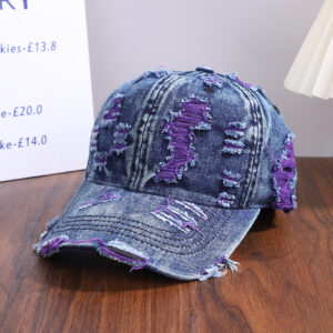 Wholesale-washed-black-denim-baseball-cap-with-custom-distressed-ripped-holes-revealing-a-bright-blue-underlayer-displayed-for-bulk-clothing-supplier-7