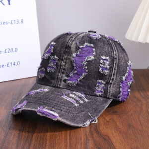 Wholesale-washed-black-denim-baseball-cap-with-custom-distressed-ripped-holes-revealing-a-bright-blue-underlayer-displayed-for-bulk-clothing-supplier-8